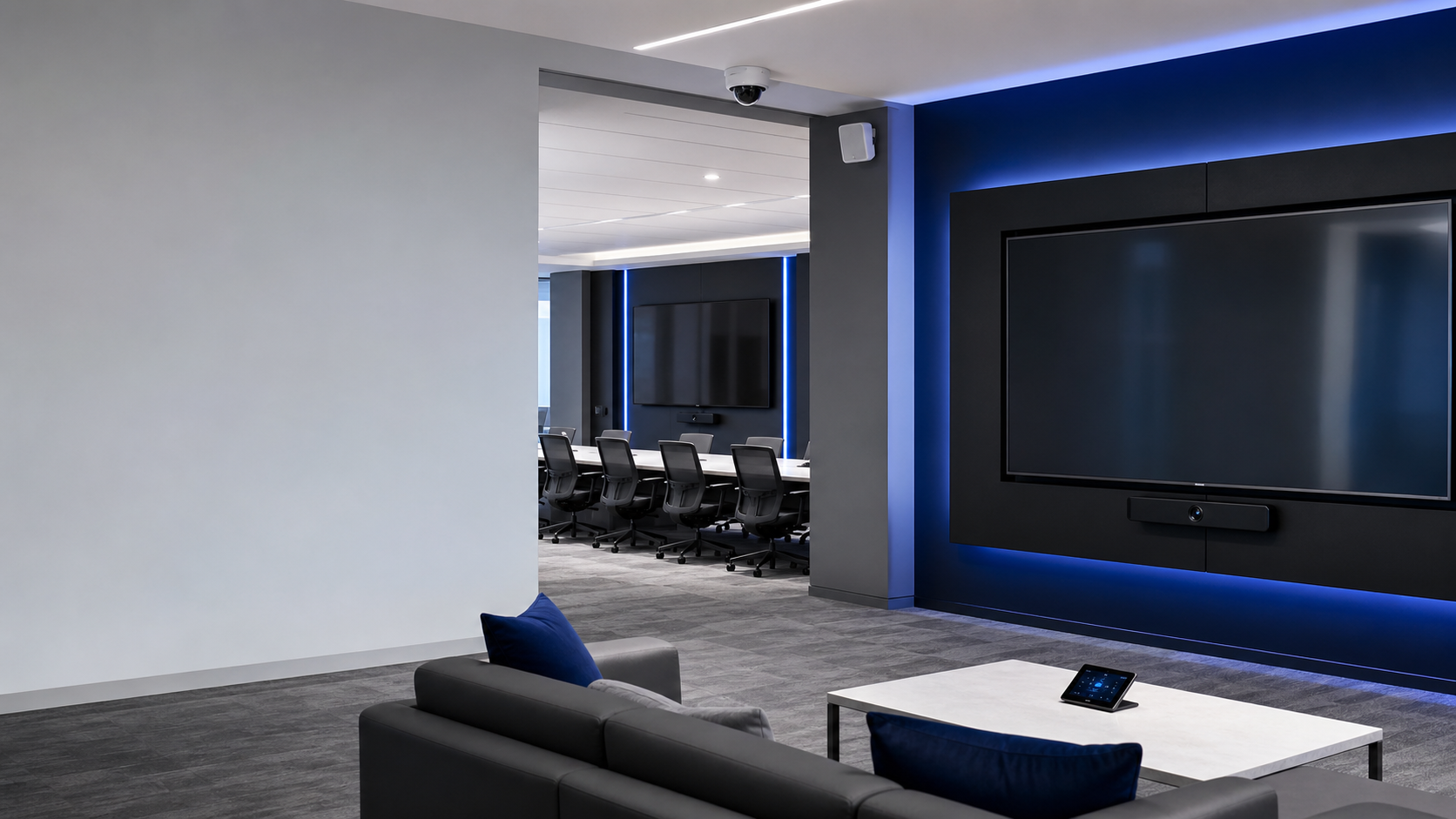Modern commercial AV installation with mounted displays, camera, and clean technology setup